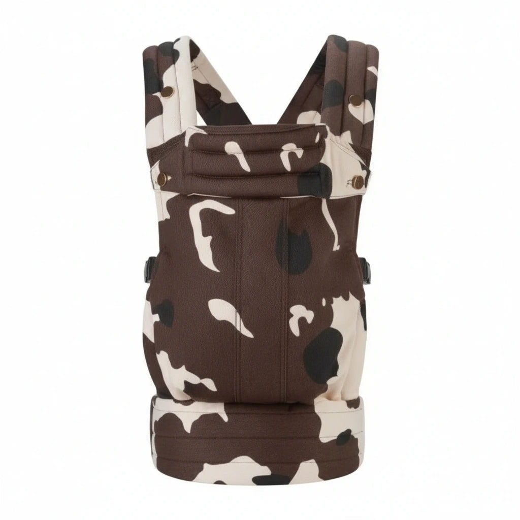 Brown and white cow print baby carrier on a white background