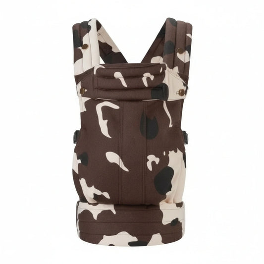 Brown and white cow print baby carrier on a white background