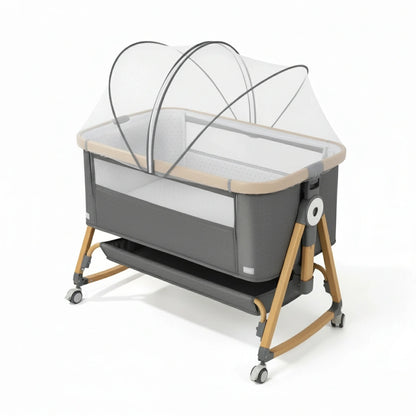 Portable baby crib with canopy on a white background